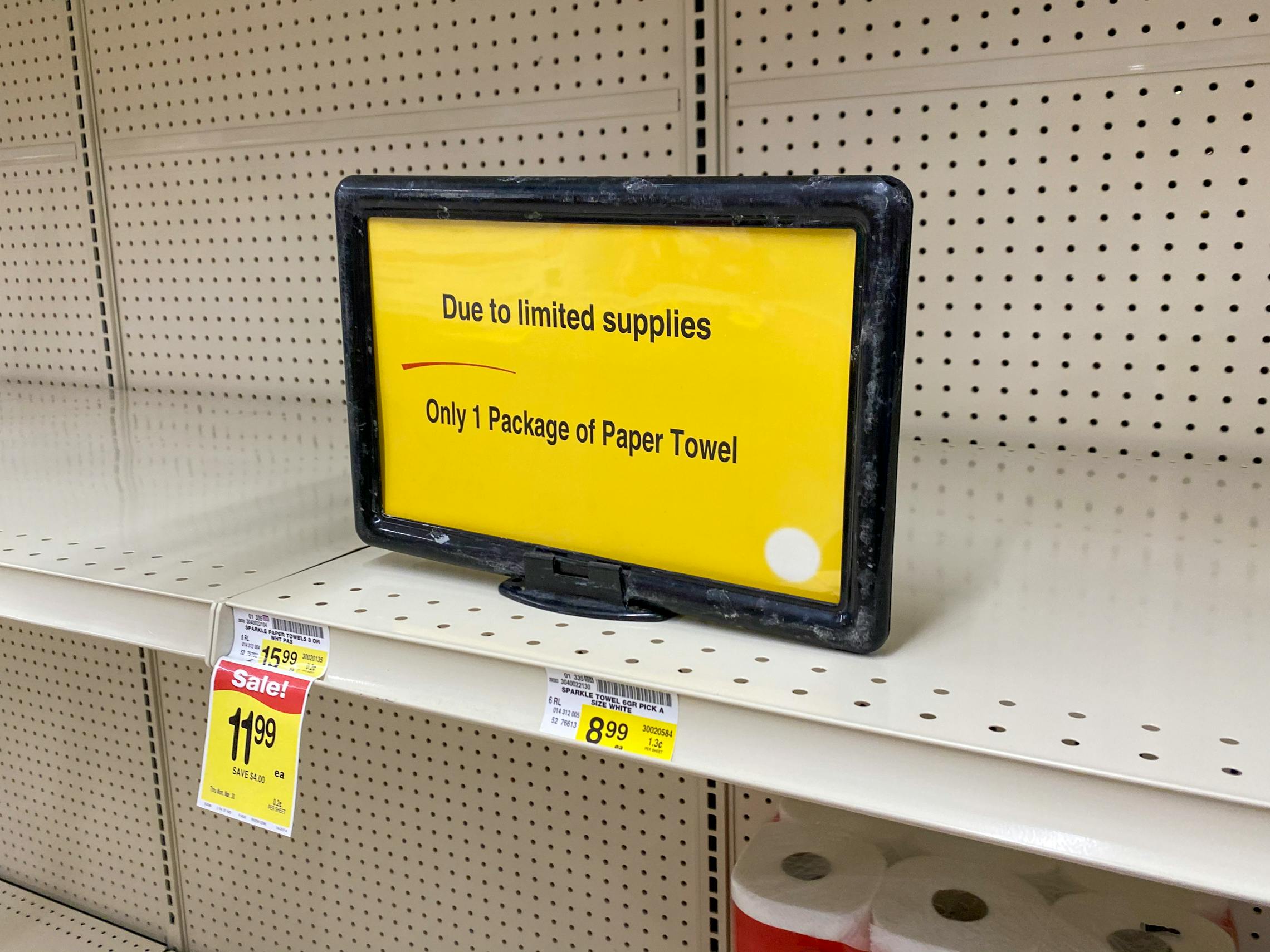 Yellow sign, "Due to limited supplies Only 1 Package of Paper Towel.