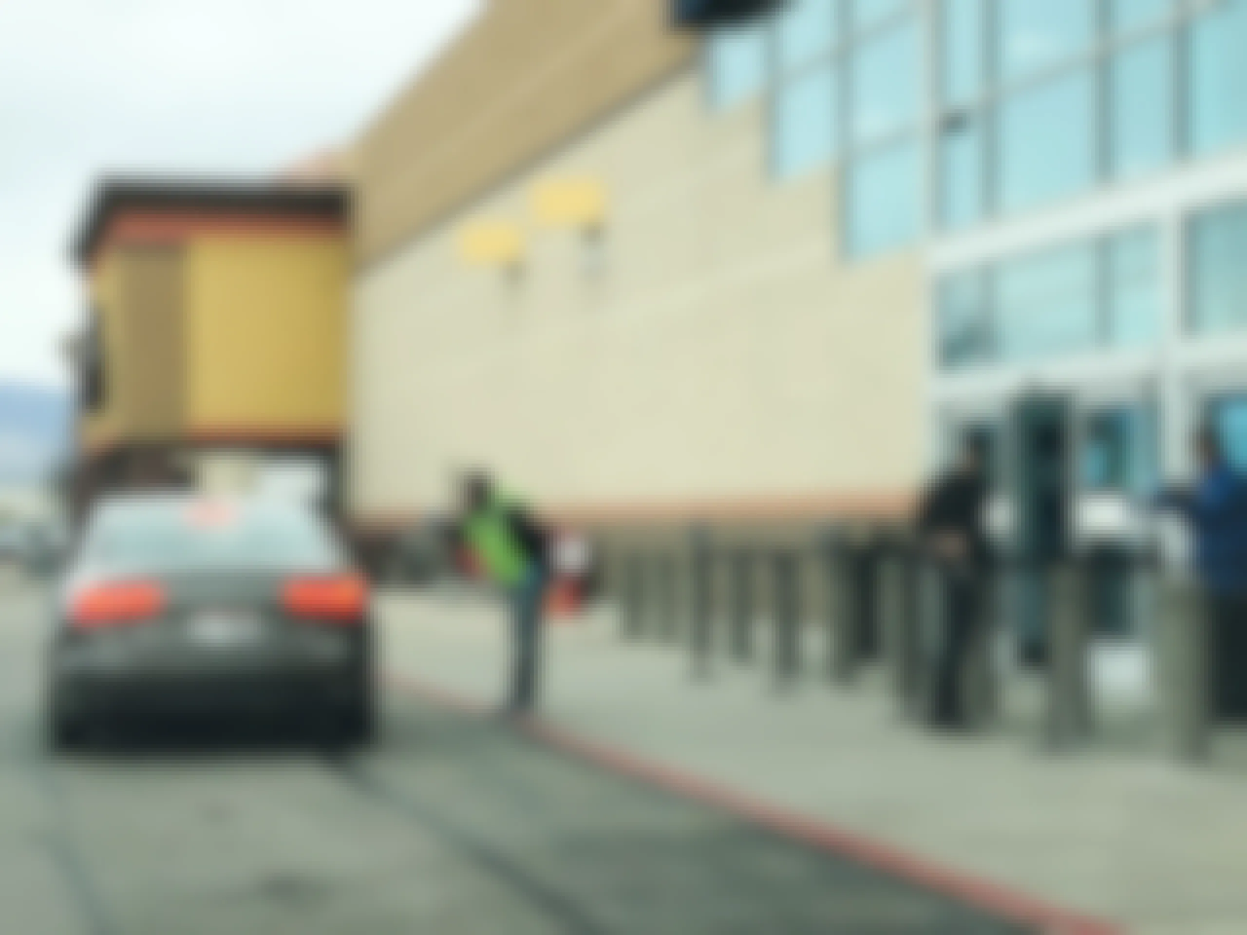 Best Buy curbside pickup with employees standing outside