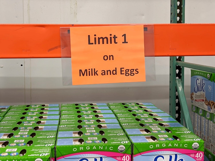 A sign for eggs and milk that reads "limit 1