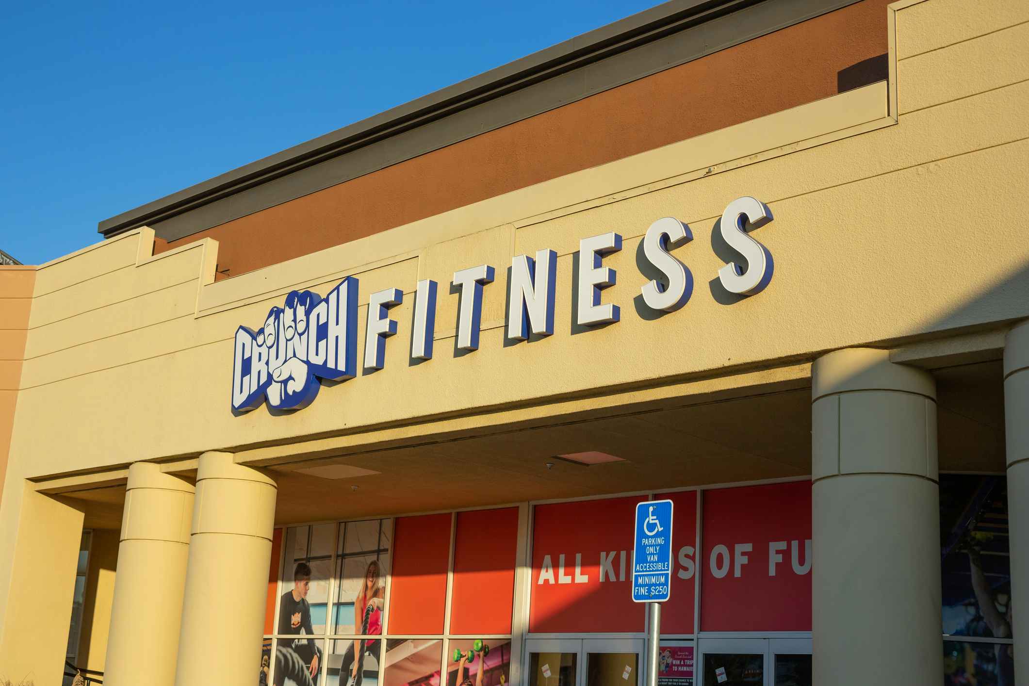 A store front sign for the gym chain known as Crunch Fitness