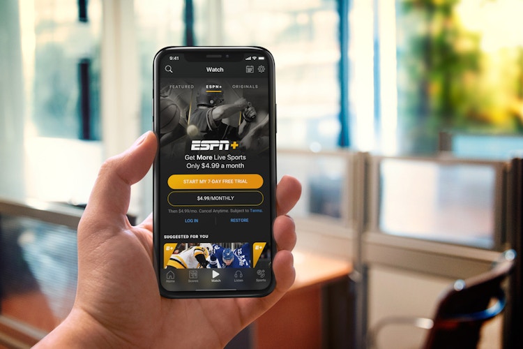 someone holding phone with ESPN+ app open