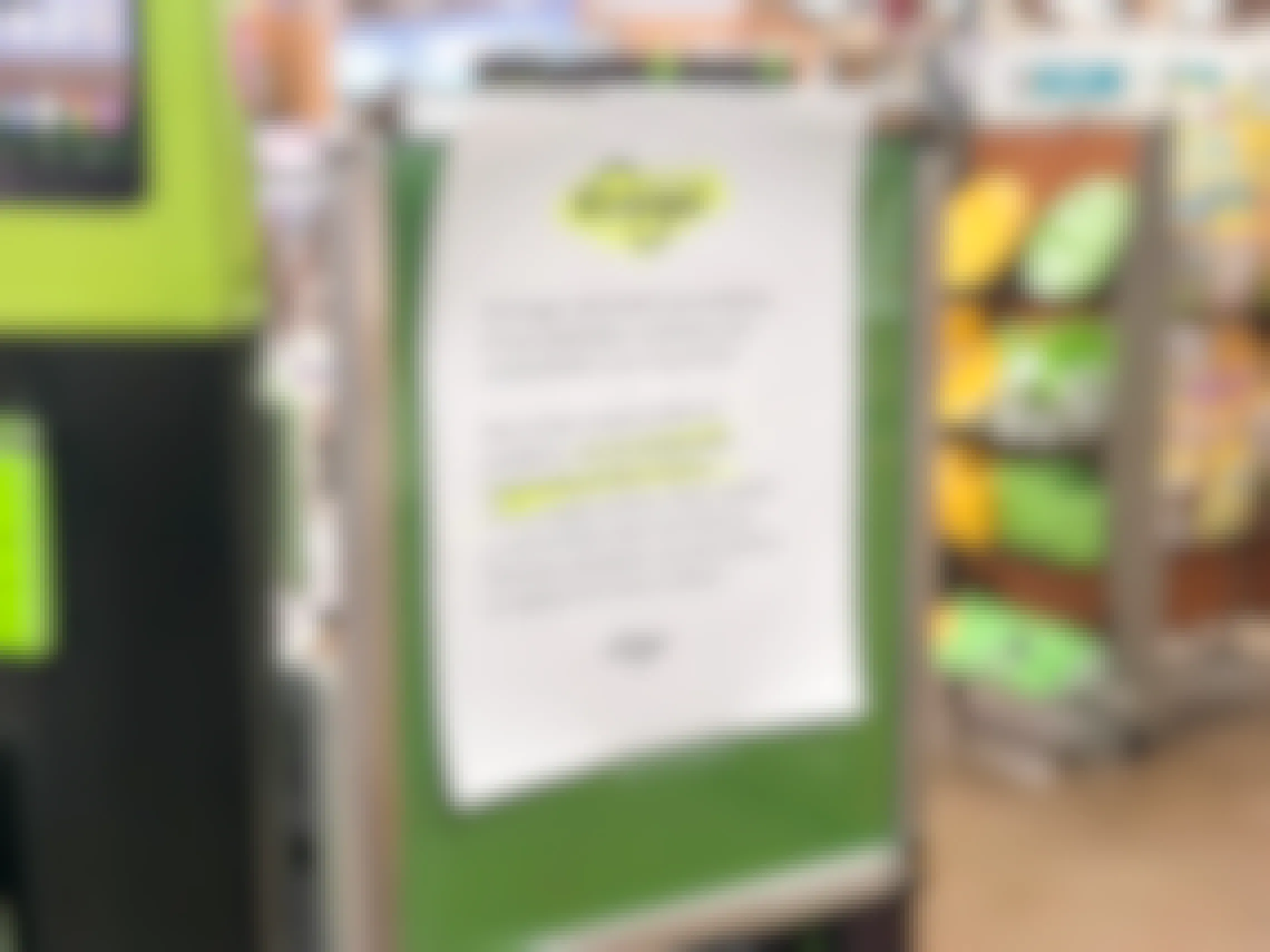 A sign inside a Kroger store, "due to the current Corvid-19 pandemic, we are temporarily suspending product returns.