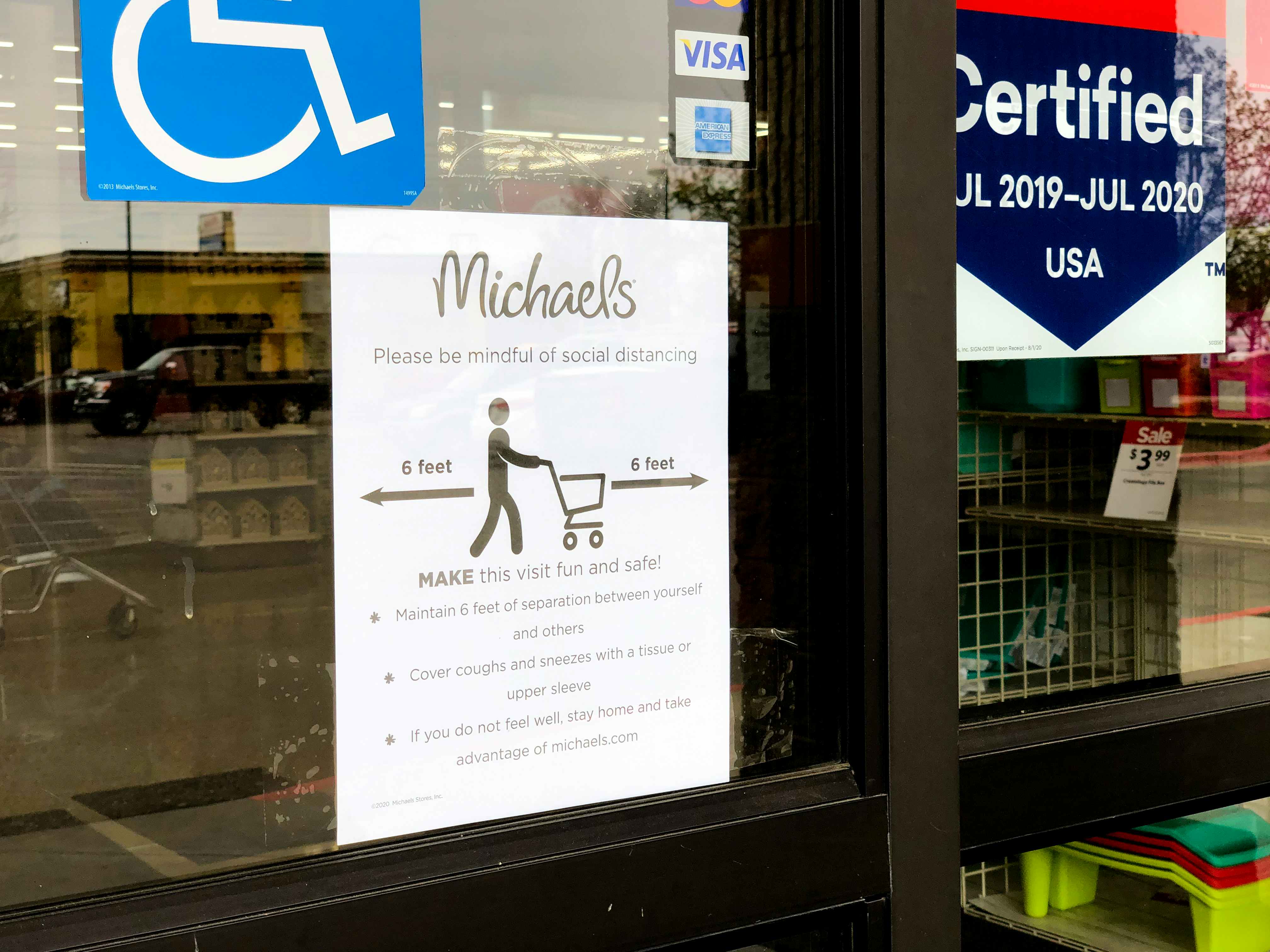 Open signs at the entrance of Michaels during the coronavirus outbreak.