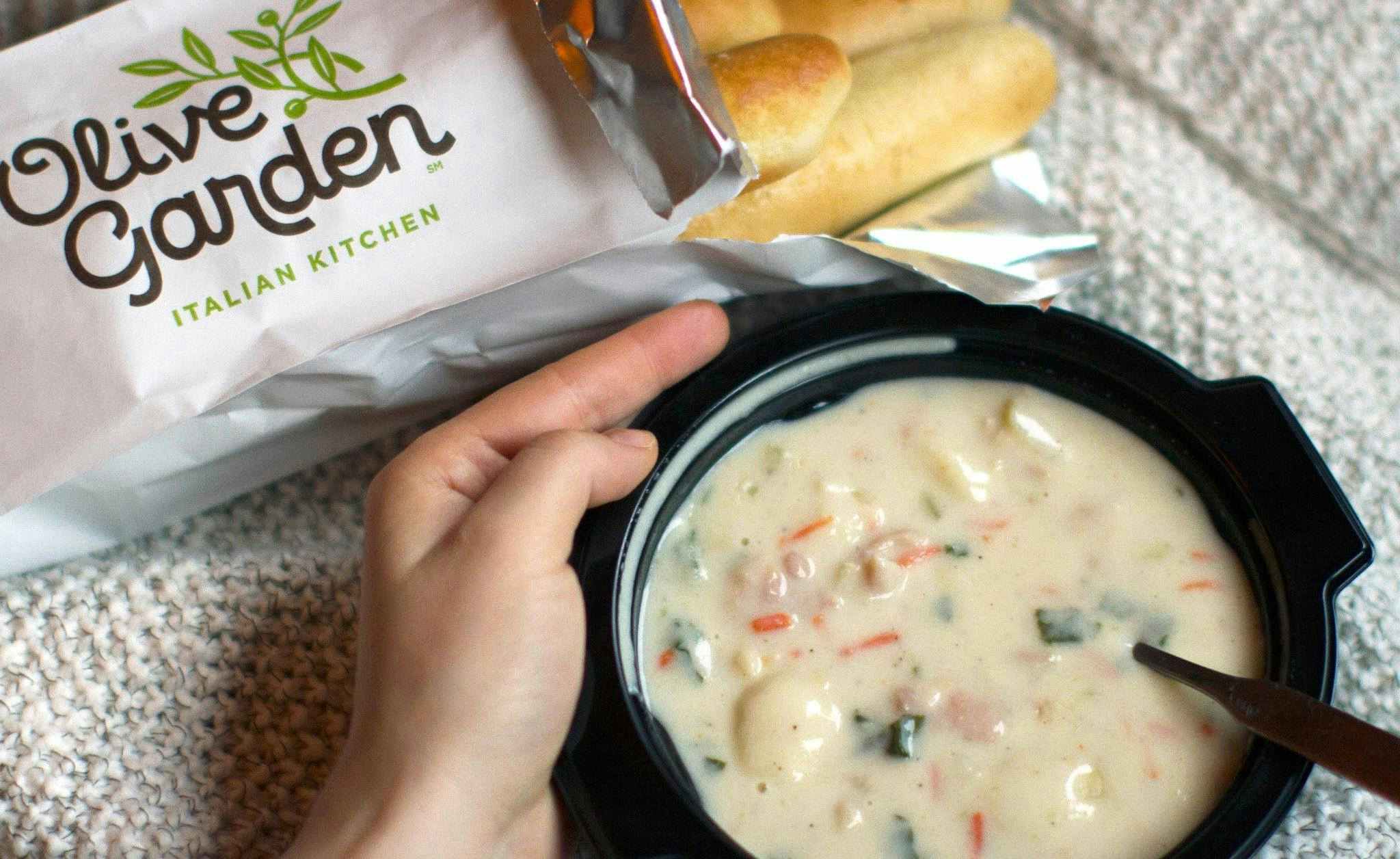 A takeout order of breadsticks and soup from Olive Garden