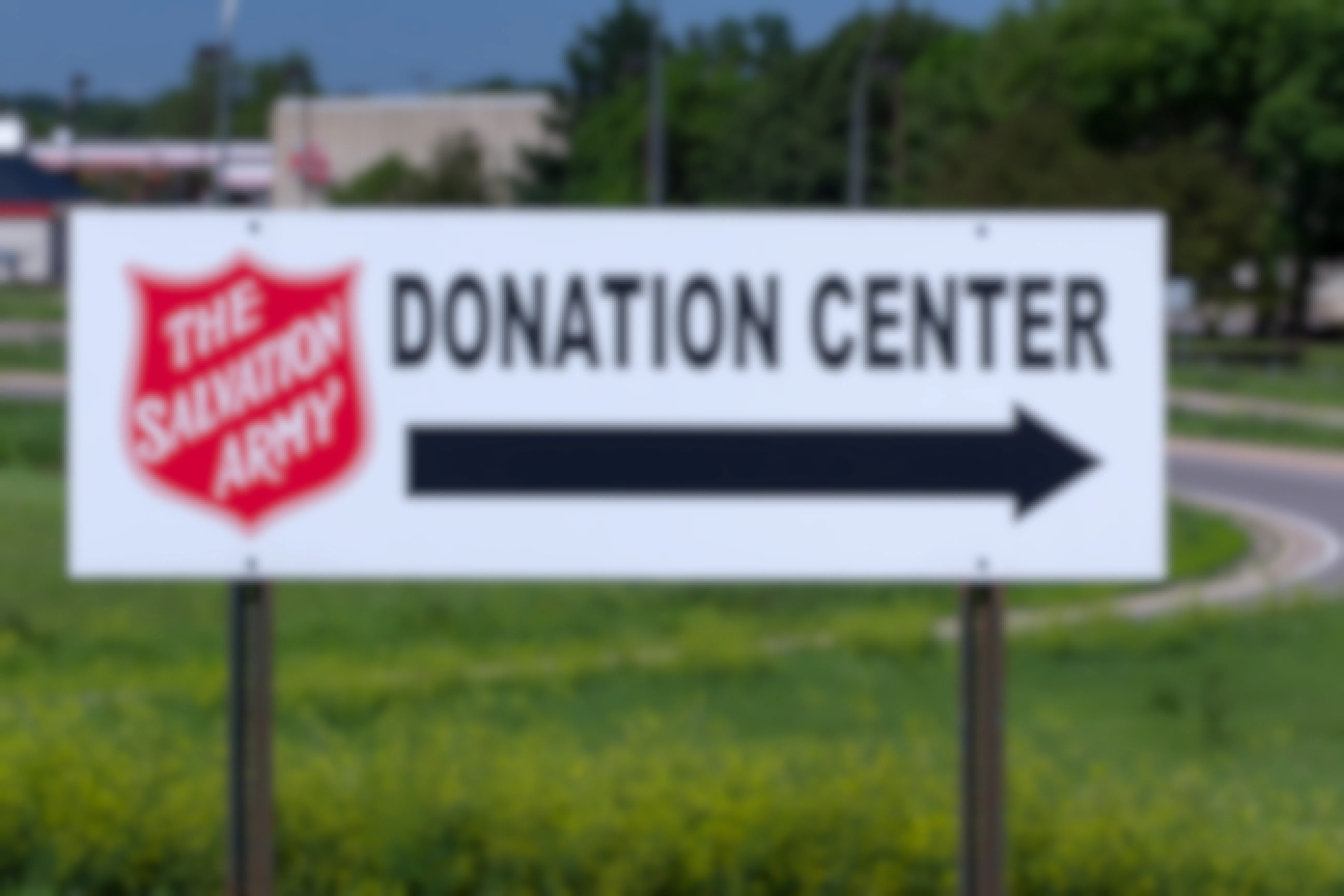 The Salvation Army Donation Center sign with a large black arrow pointing to the right.