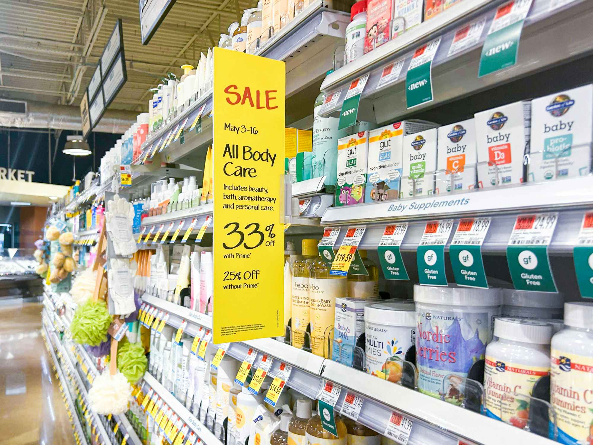 A shelf of body care items in Whole Foods with large SALE signs 33% off for Prime Members and 25% off for non members