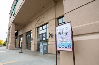 Barnes and Nobel store front with curbside pickup sign