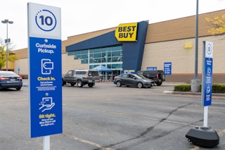 Curbside pickup signs in the parking lot in front of Best Buy.