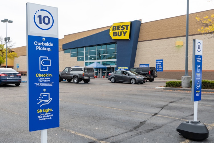 Curbside pickup signs in the parking lot in front of Best Buy.