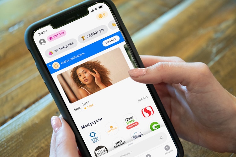Someone looking at the Drop app on a cell phone