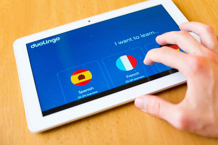 The Duolingo interface is displayed on a smart tablet