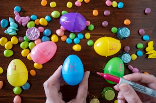 Plastic Easter eggs with the letter spelling out "Garage" written on each egg.