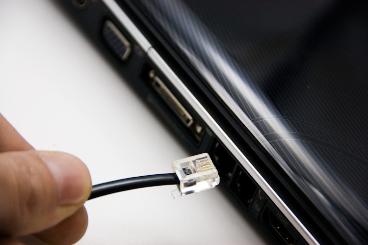 Internet connection. hand holding network connection ready to hook it up
