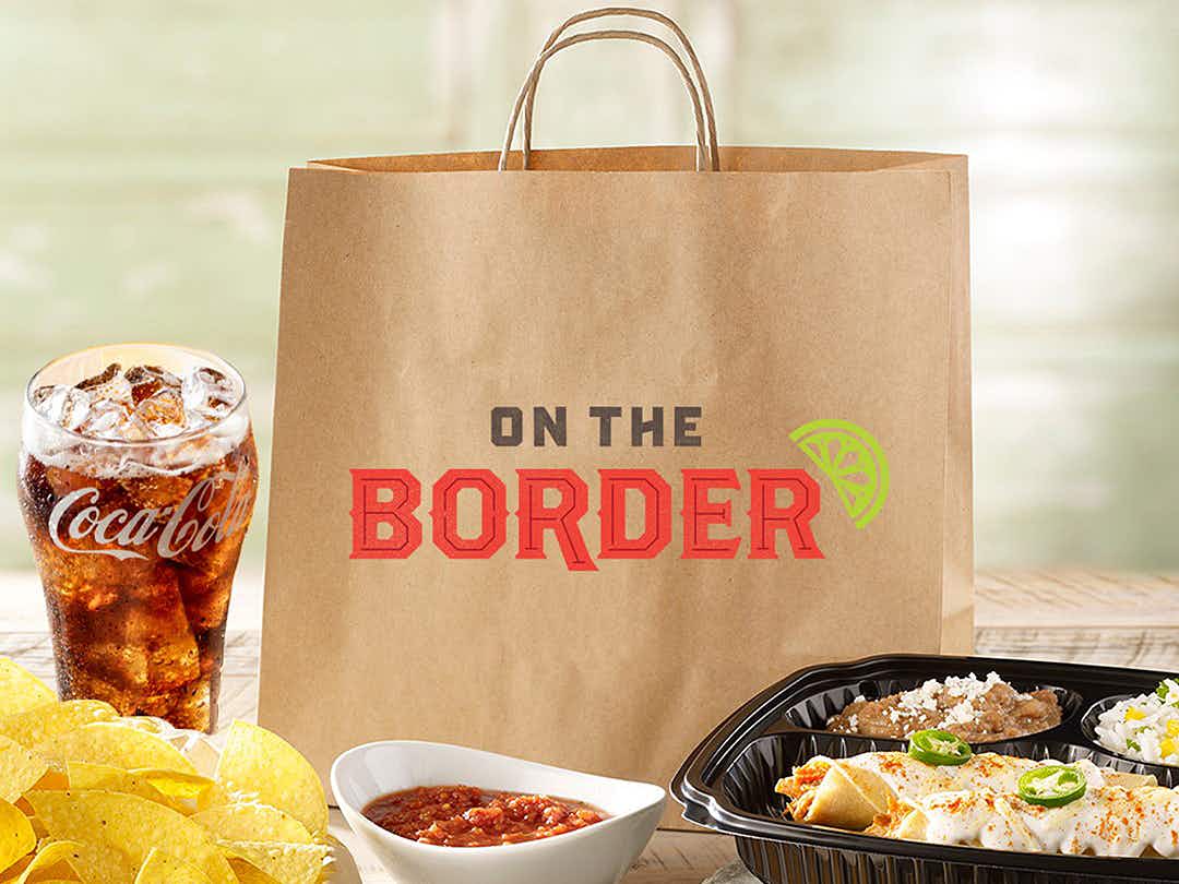 on the border restaurant carry-out bag, drink, chips, salsa, and enchiladas