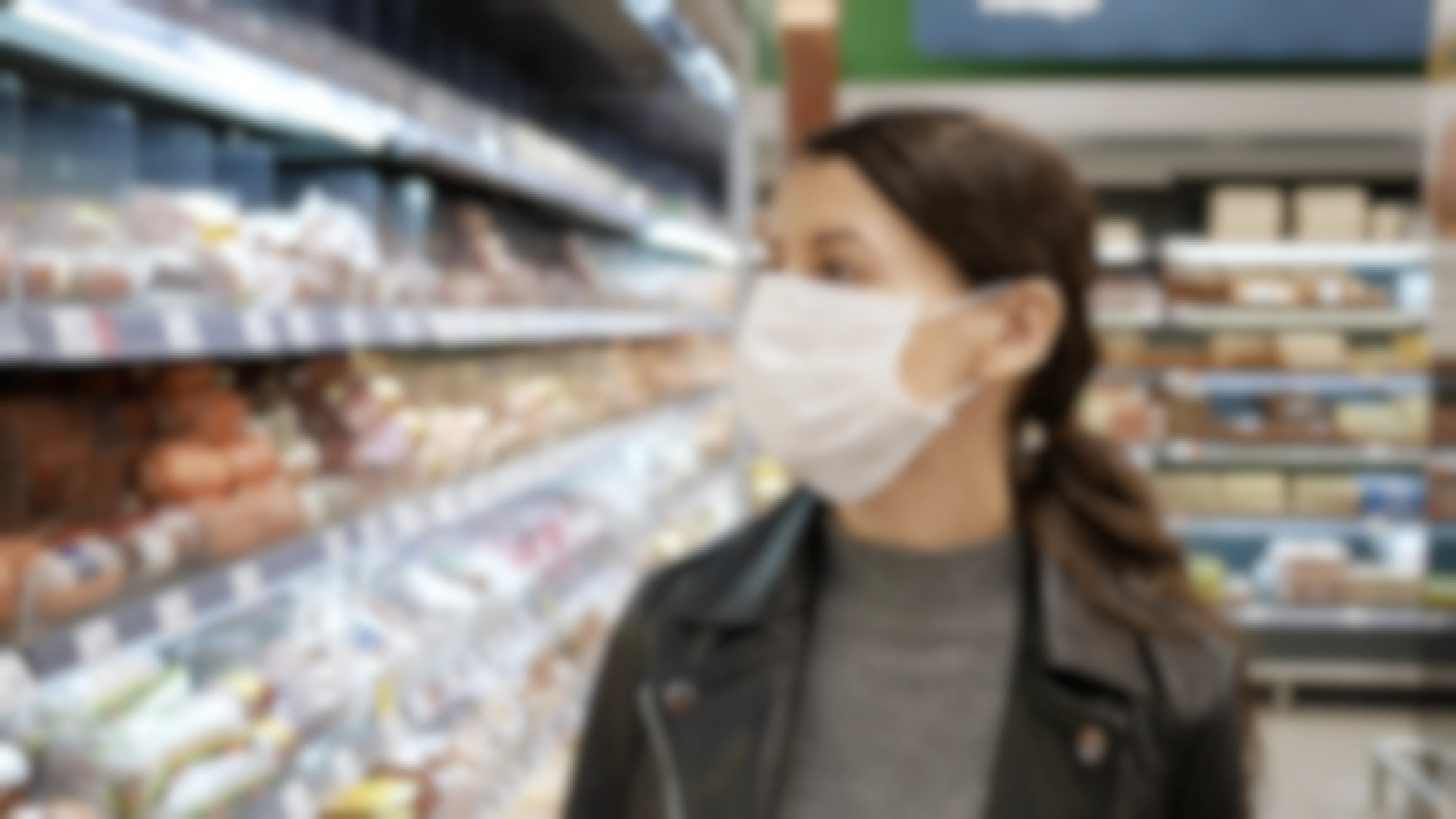 woman wearing a face mask in a grocery store