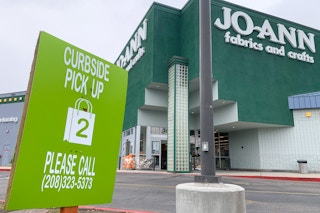 Joann fabrics and crafts store front with curbside pickup sign