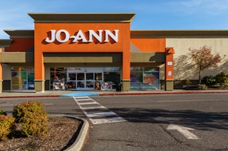 JOANN craft storefront and parking lot.