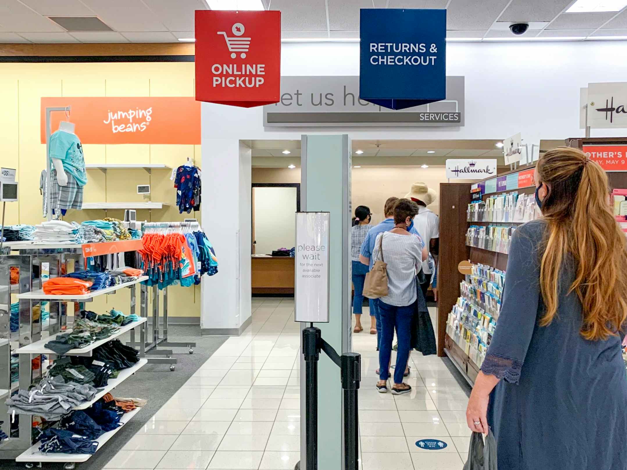 A woman standing in the Kohl's return line.