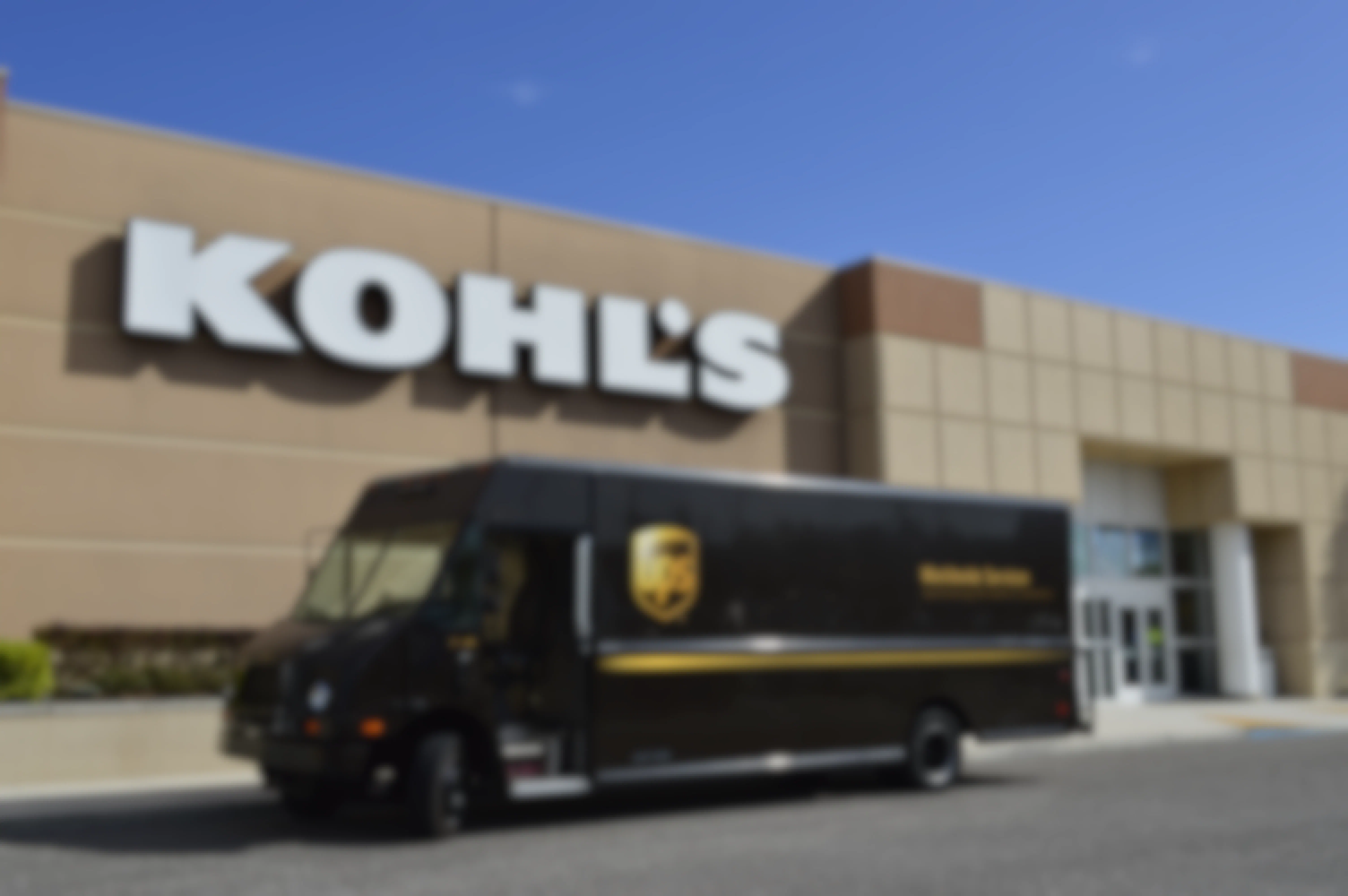 UPS truck in front of a Kohl's store