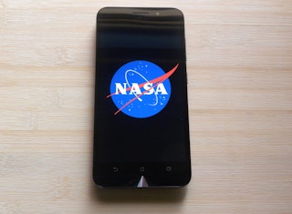 A NASA logo displayed on a smartphone