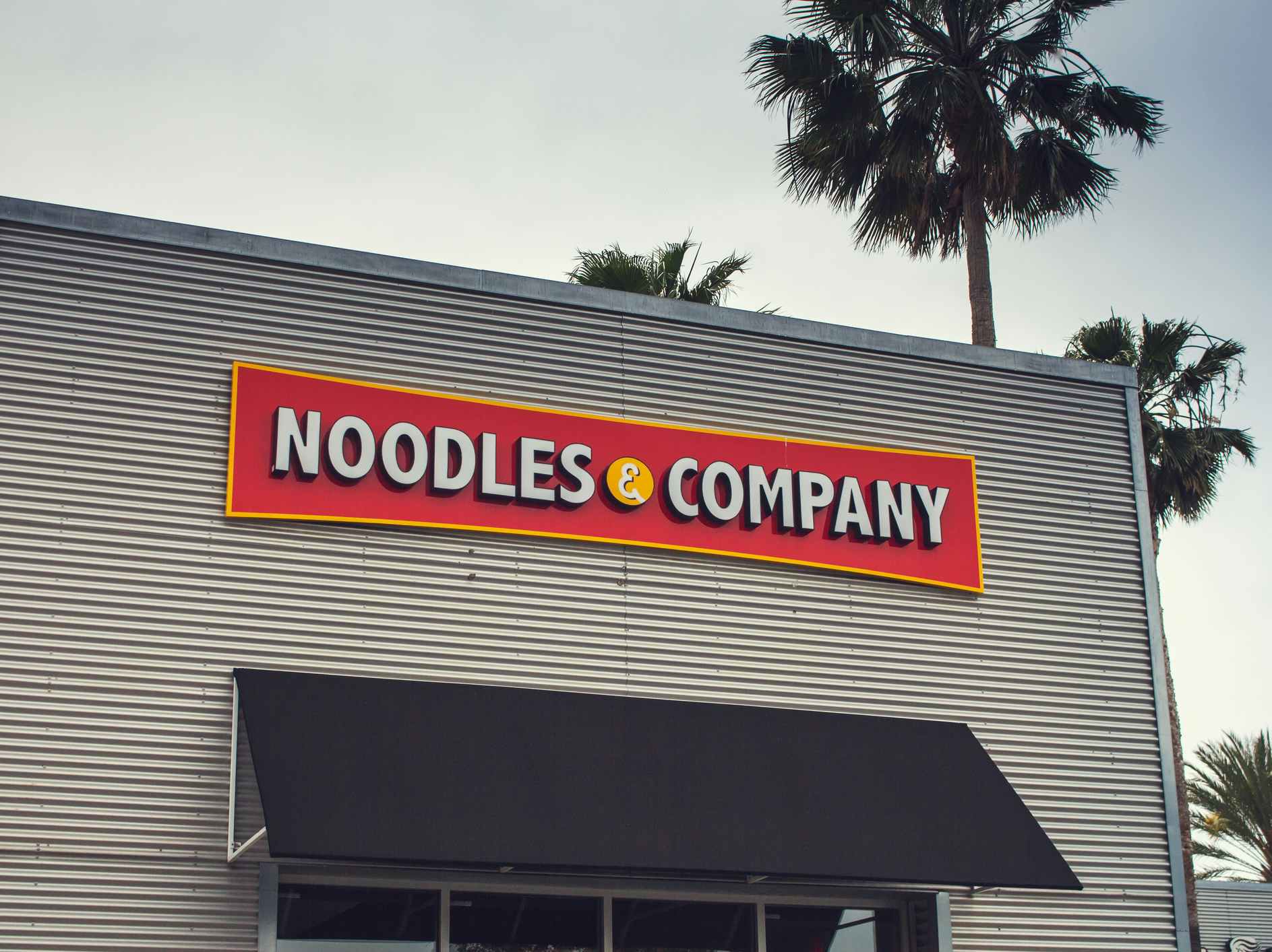 Exterior of a Noodles & Company restaurant.