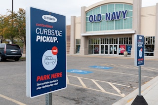 Old Navy store front with curbside pickup sign