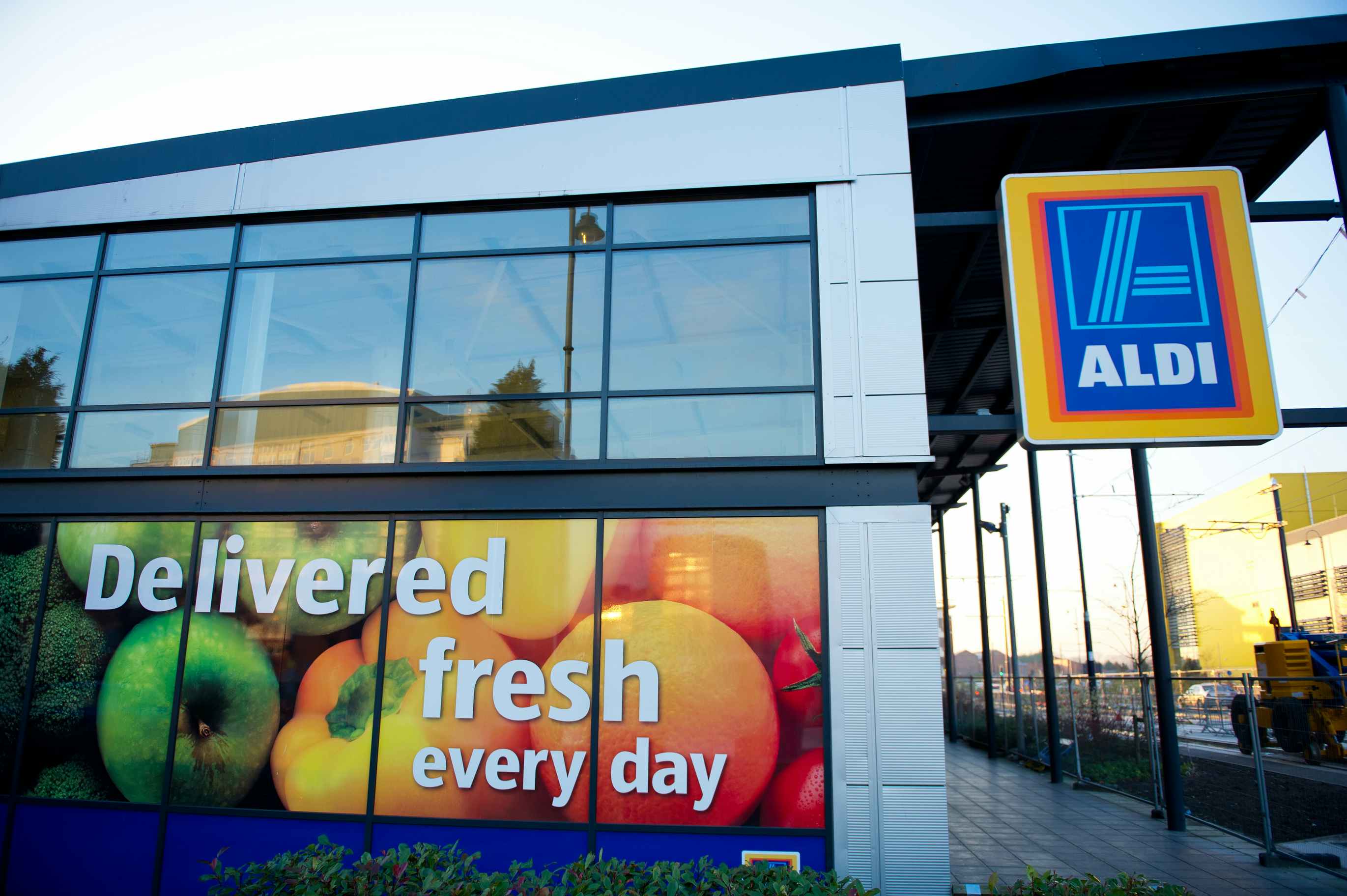 ALDI storefront with a big sign that says "Delivered fresh every day.