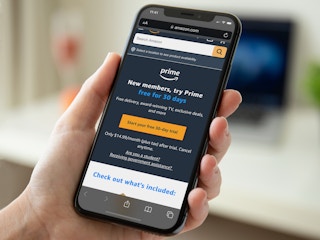 Someone looking on their phone at the webpage for Amazon Prime free trial