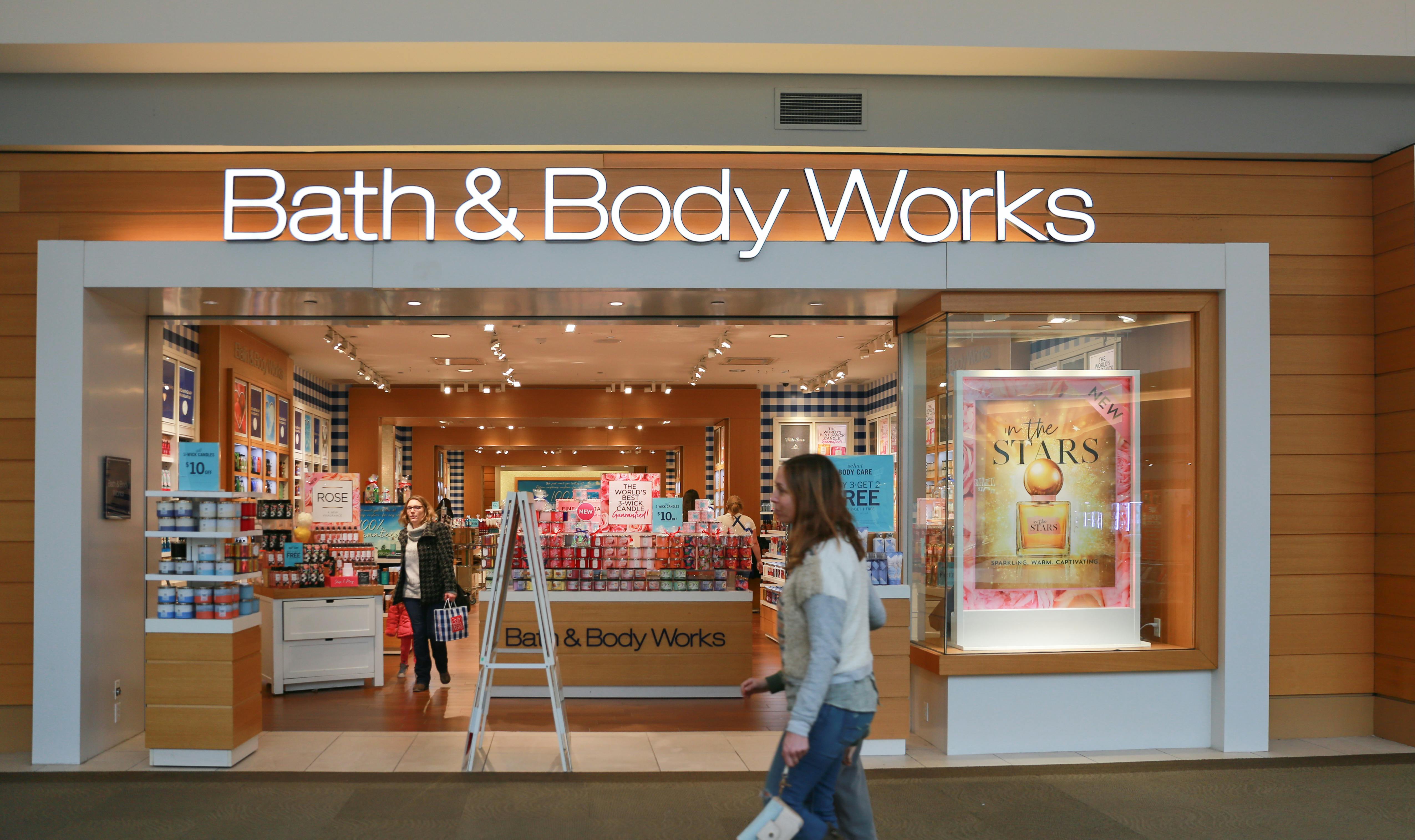 bath and body works entrance in mall with passersby
