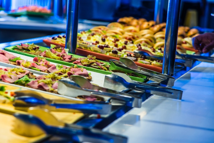Buffet dishes with serving tongs