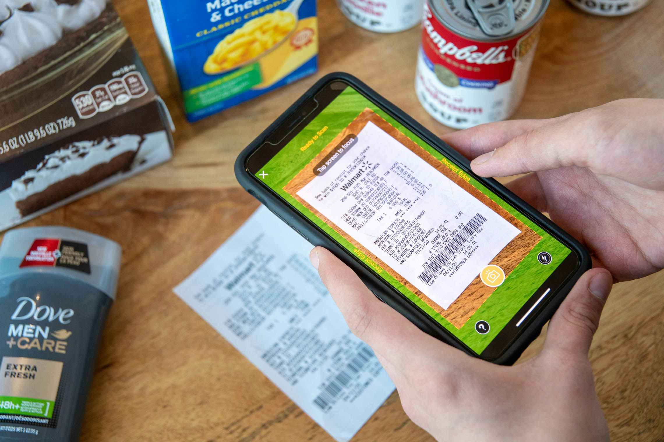 Person scanning a receipt into the Fetch Rewards app.