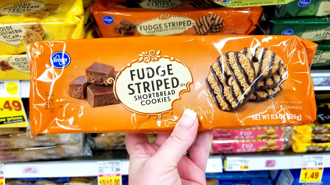 hand holds Kroger brand fudge striped cookies
