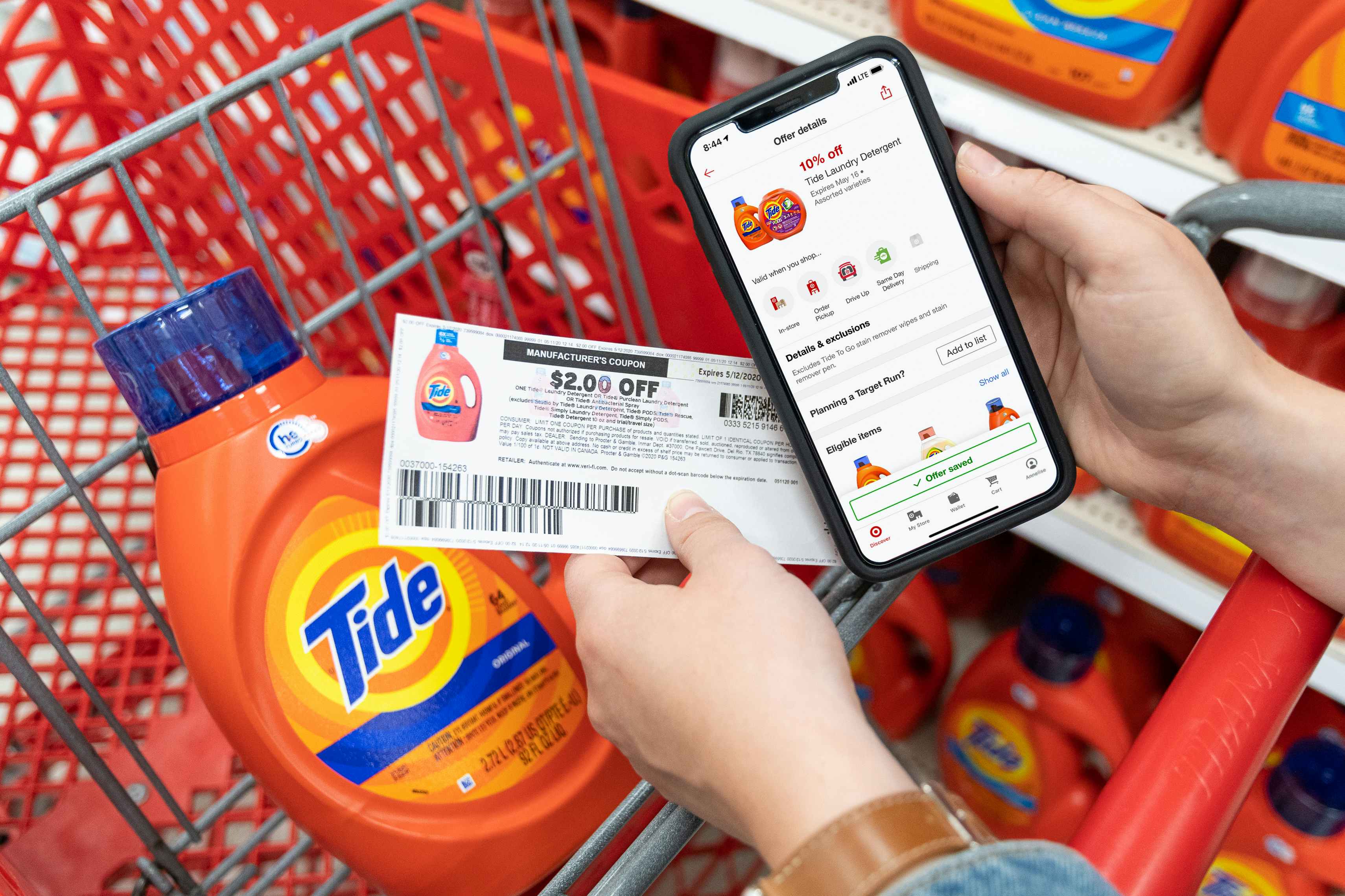 A 10% off Tide laundry detergent on the target circle app, held next to a $2 off manufacture coupon, and a bottle of Tide liquid detergent.