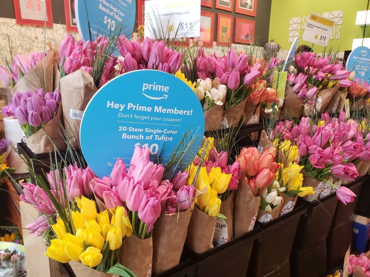 Bunches of Tulips with a Prime members sign indicating 20 stems for $10.