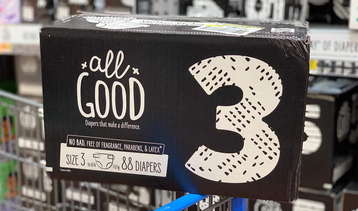 all good diapers size three in a black and white box sitting on the corner of a cart in front of other all good diapers