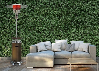 a hanover patio heater next to an outdoor sofa section on a patio