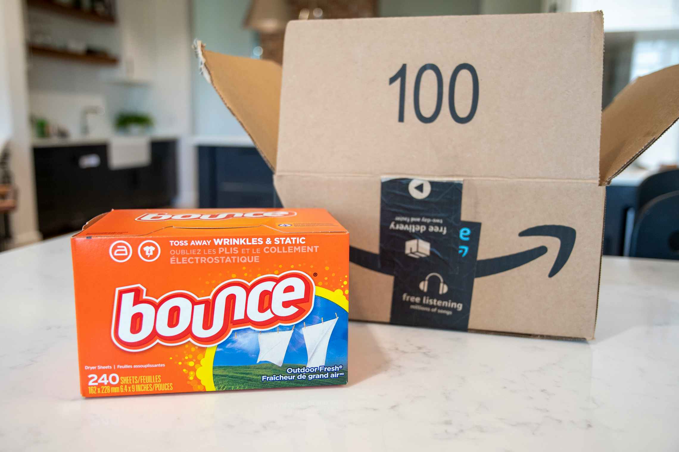 Bounce dryer sheets next to an amazon box