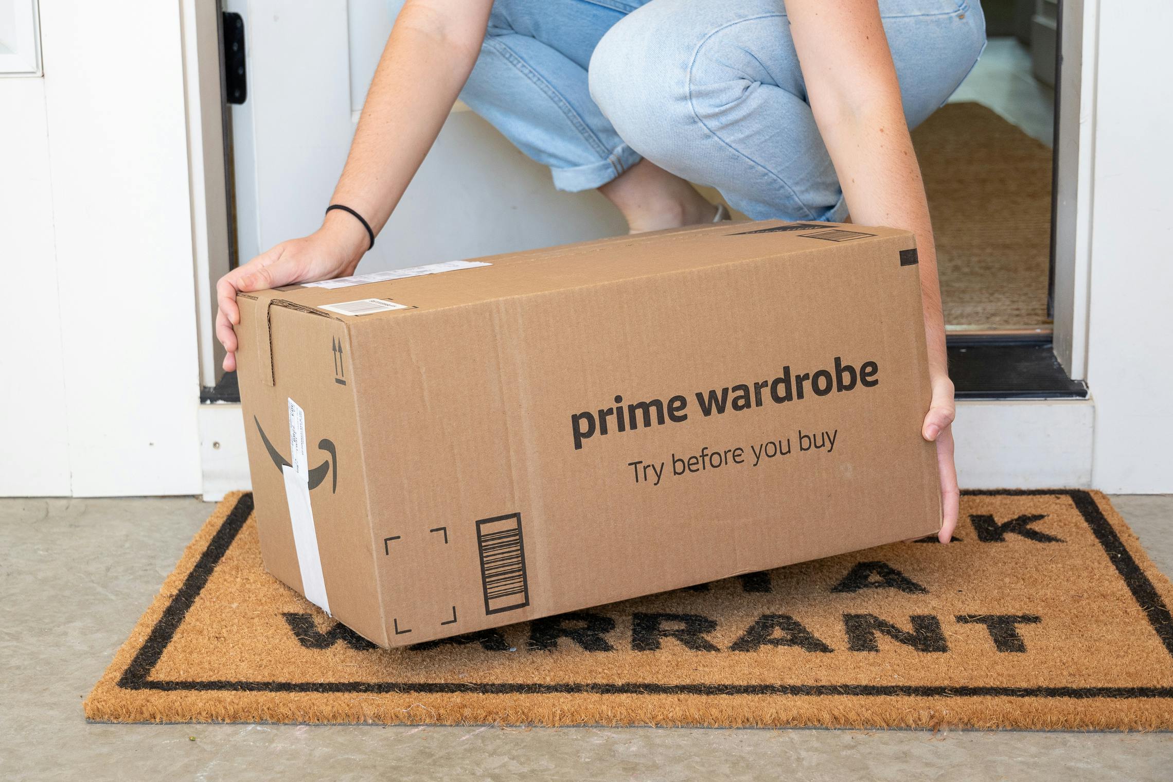 An amazon prime wardrobe box on a door step 