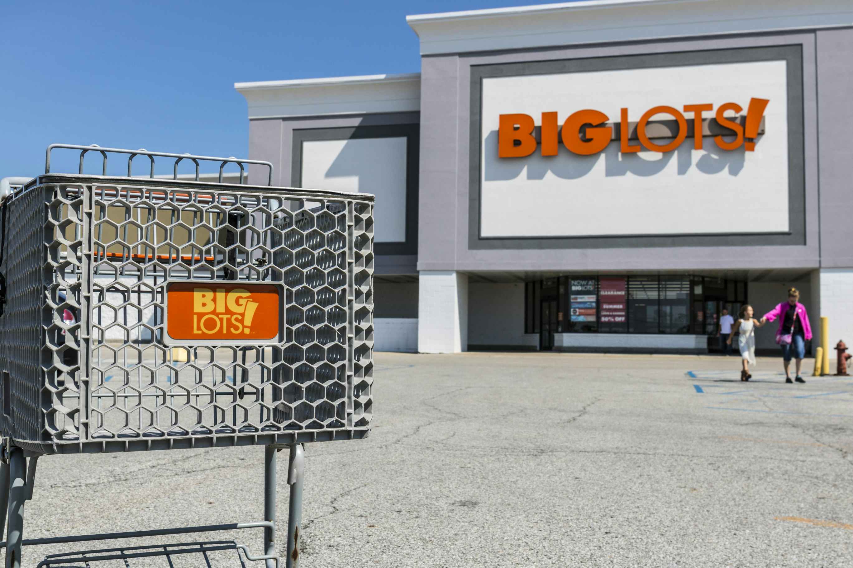 big lots store entrance and shopping cart in parking lot