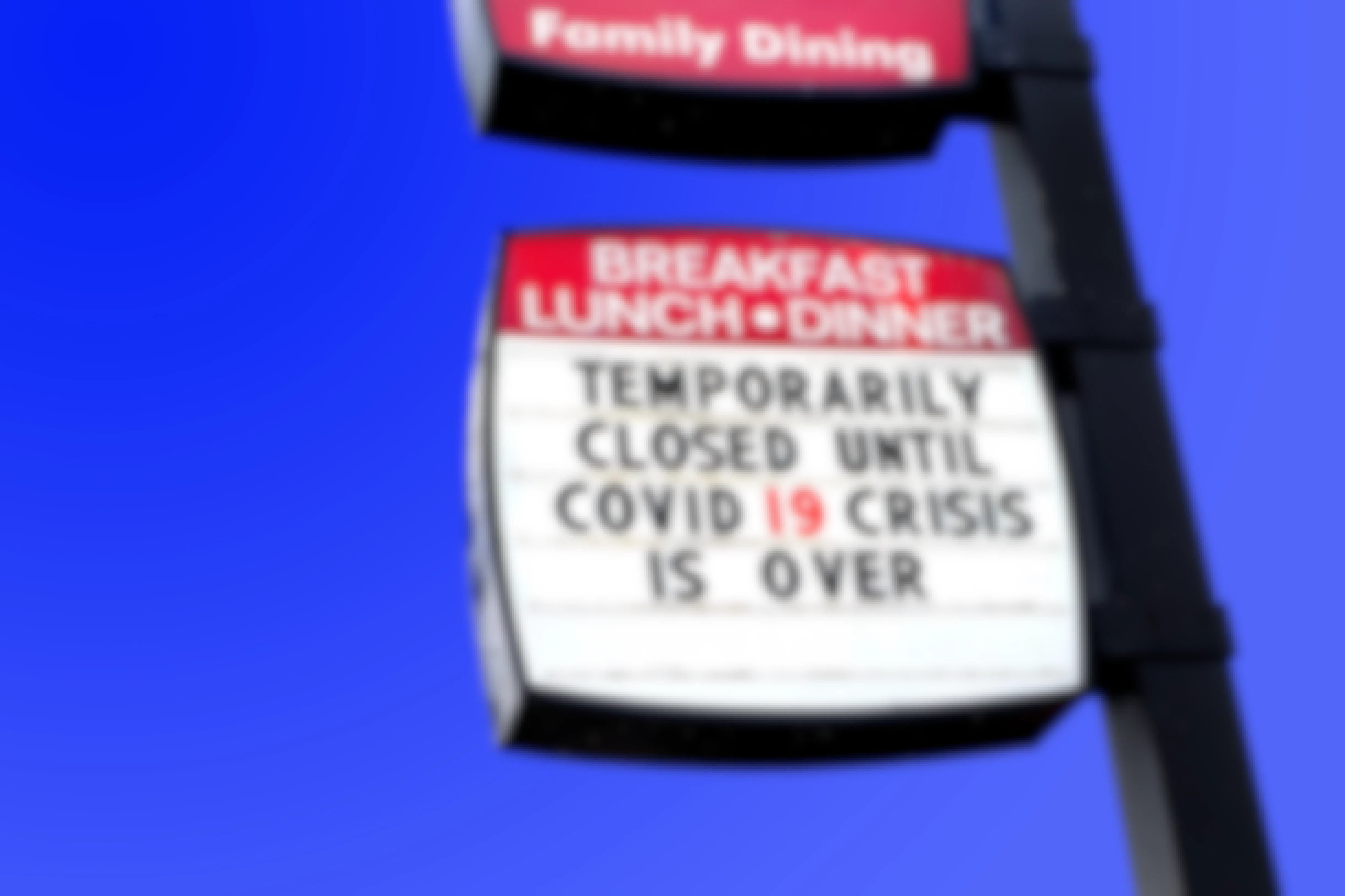 Restaurant sign announcing closure until COVID-19 passes over.