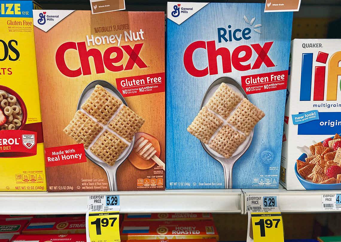 Two different flavors of Chex Cereal; Honey Nut and Rice.