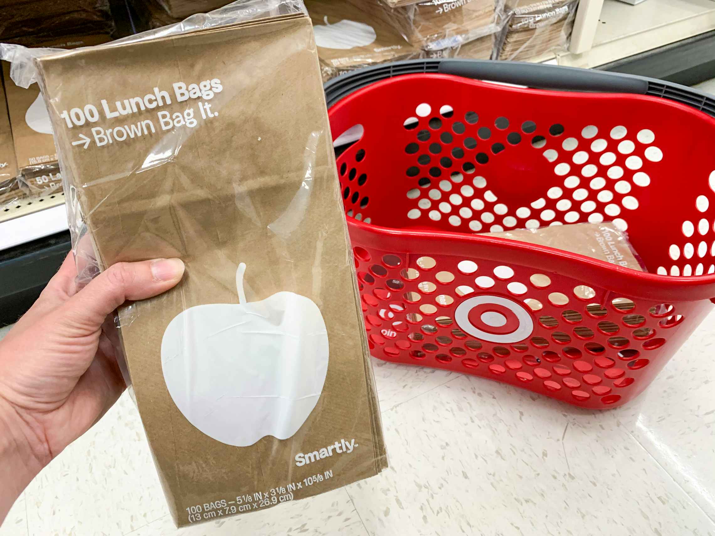 Brown paper lunch bags with a Target shopping basket.