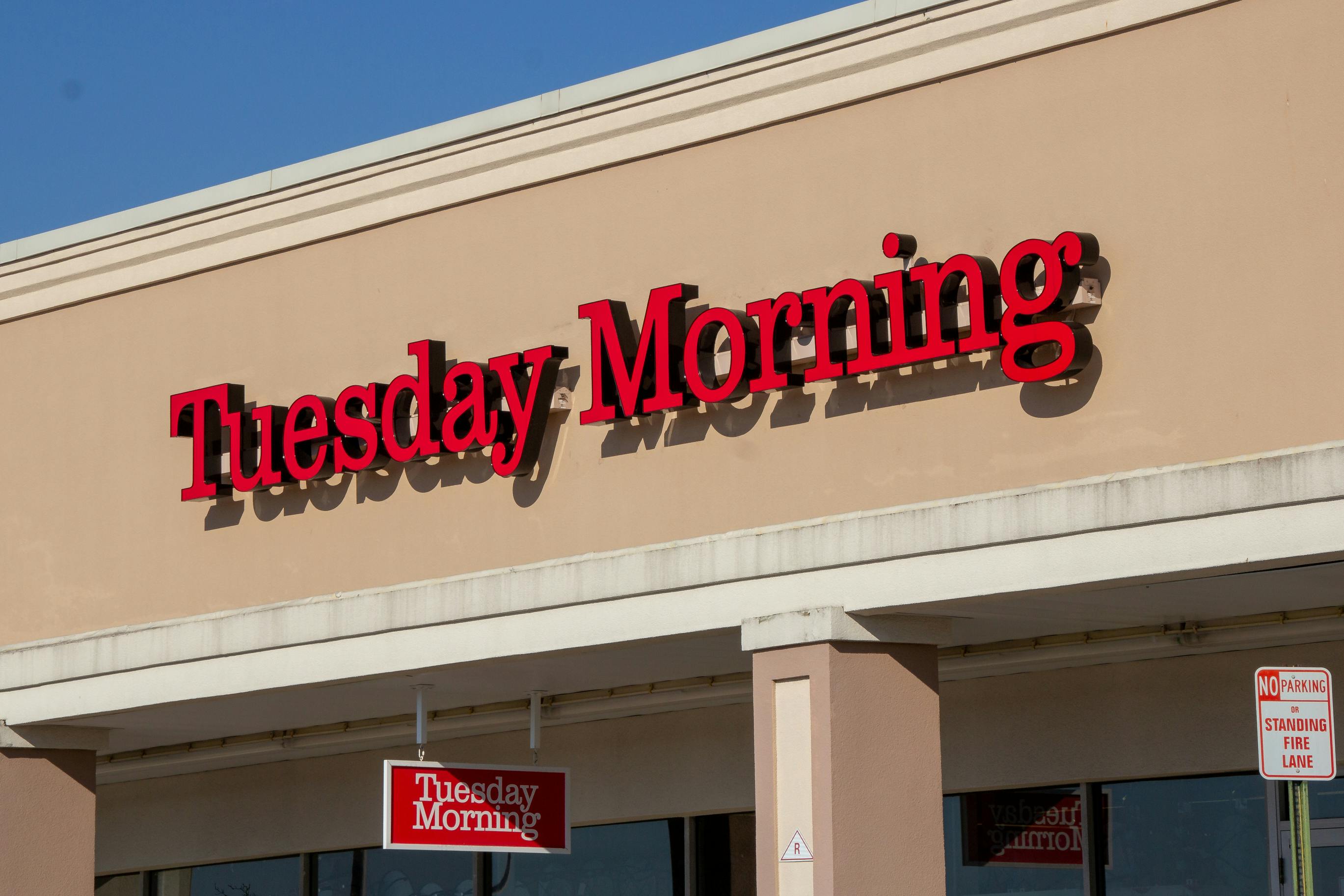 Tuesday Morning store sign on the front of a brick and mortar store location 