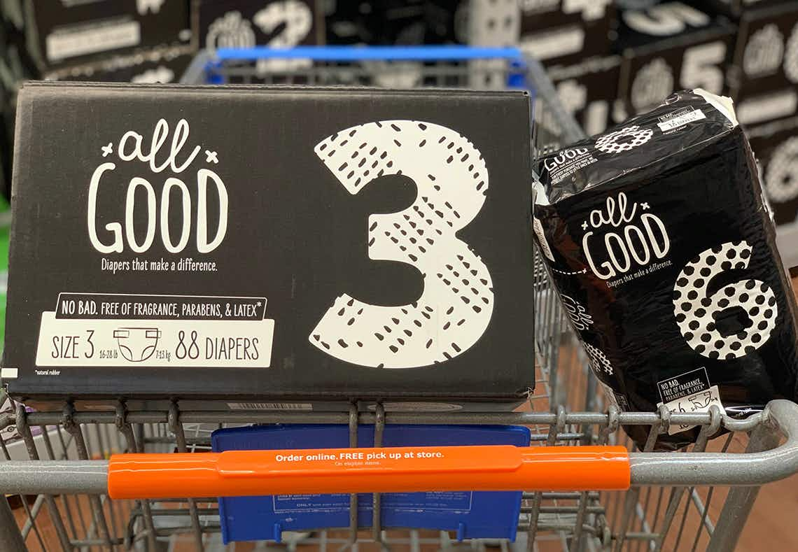 all good diapers in a large box and small plastic package in a walmart cart 