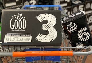 all good diapers in a large box and small plastic package in a walmart cart