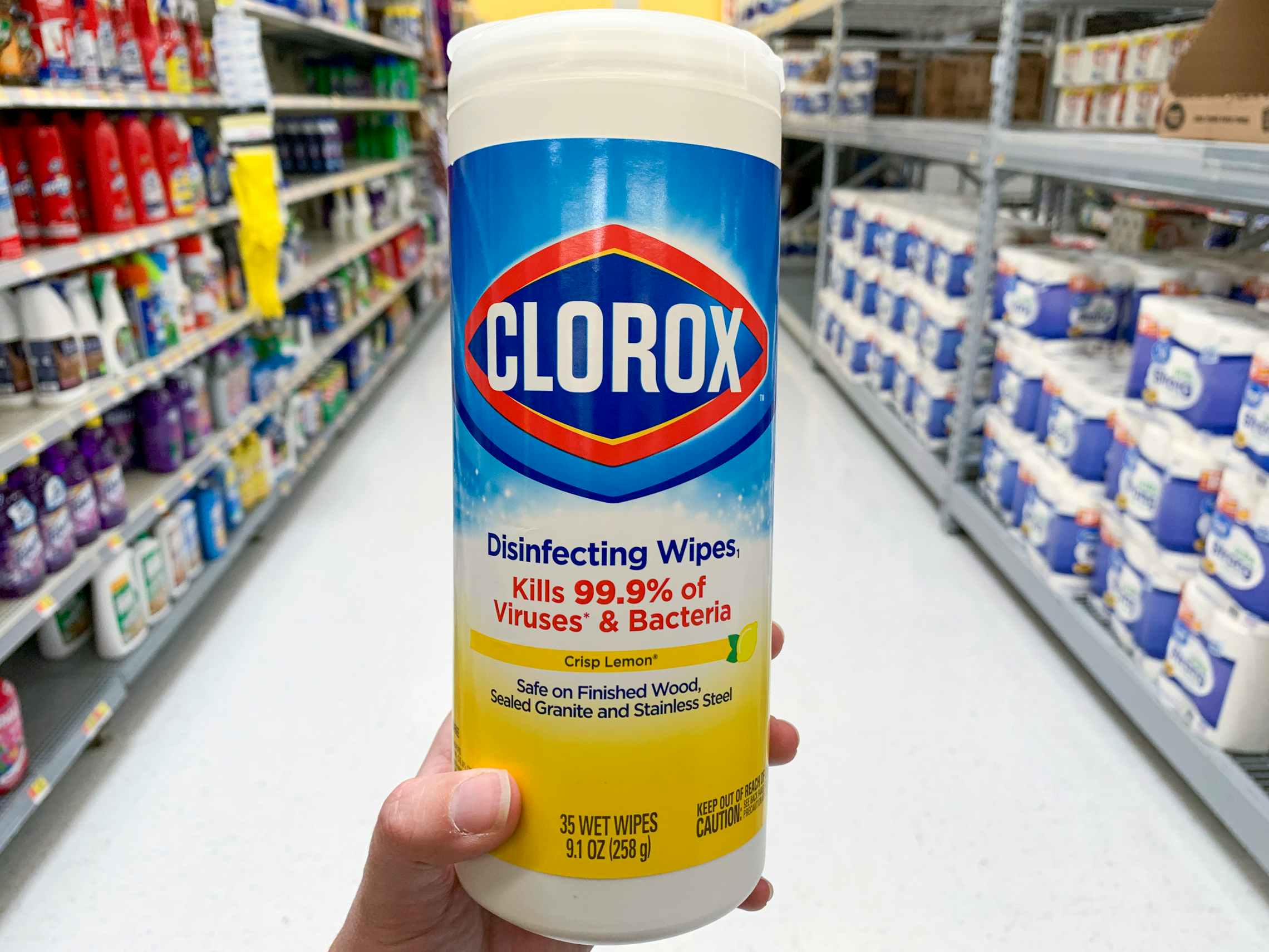 Clorox wipes container held in an aisle in Walmart.