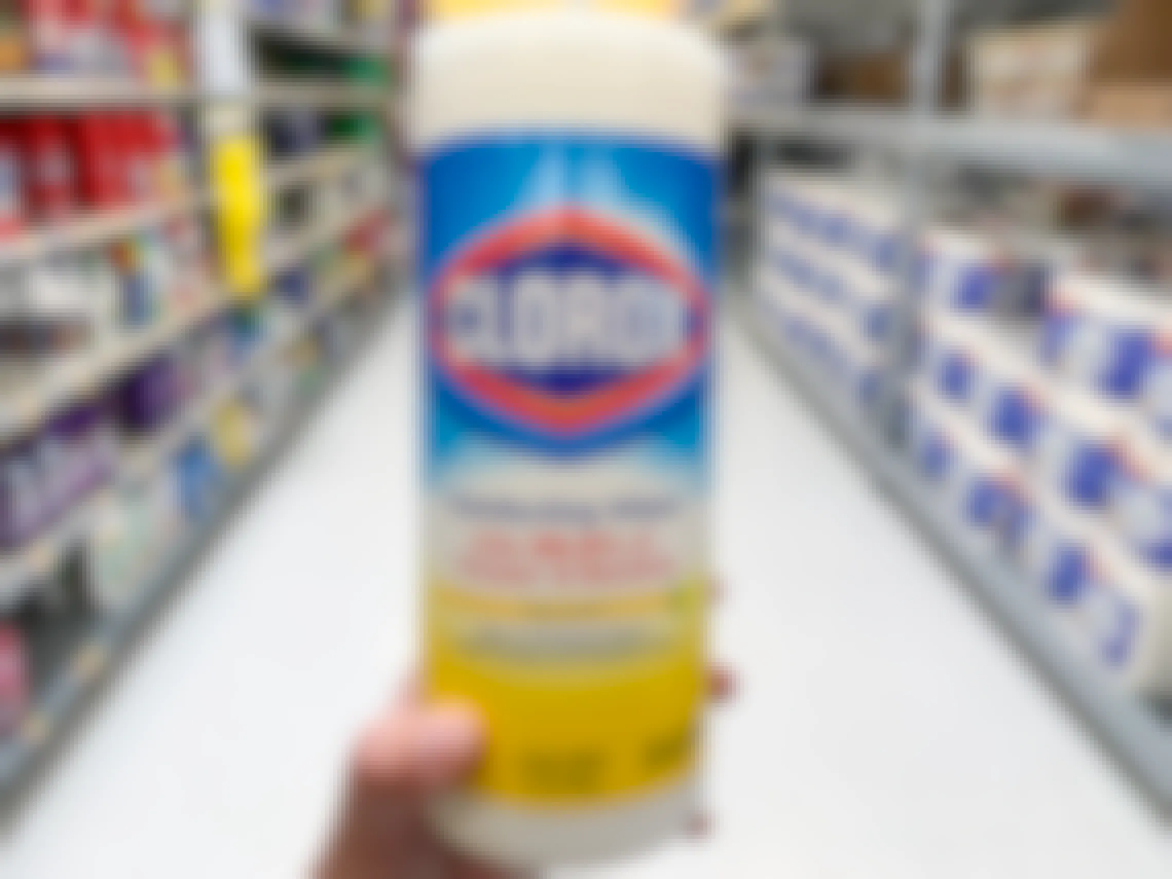 Clorox wipes container held in an aisle in Walmart.