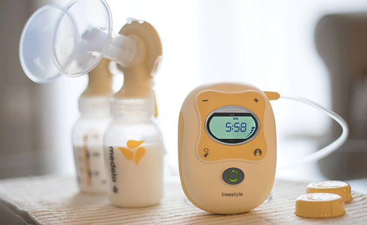 An Aeroflow electric breast pump on a table.