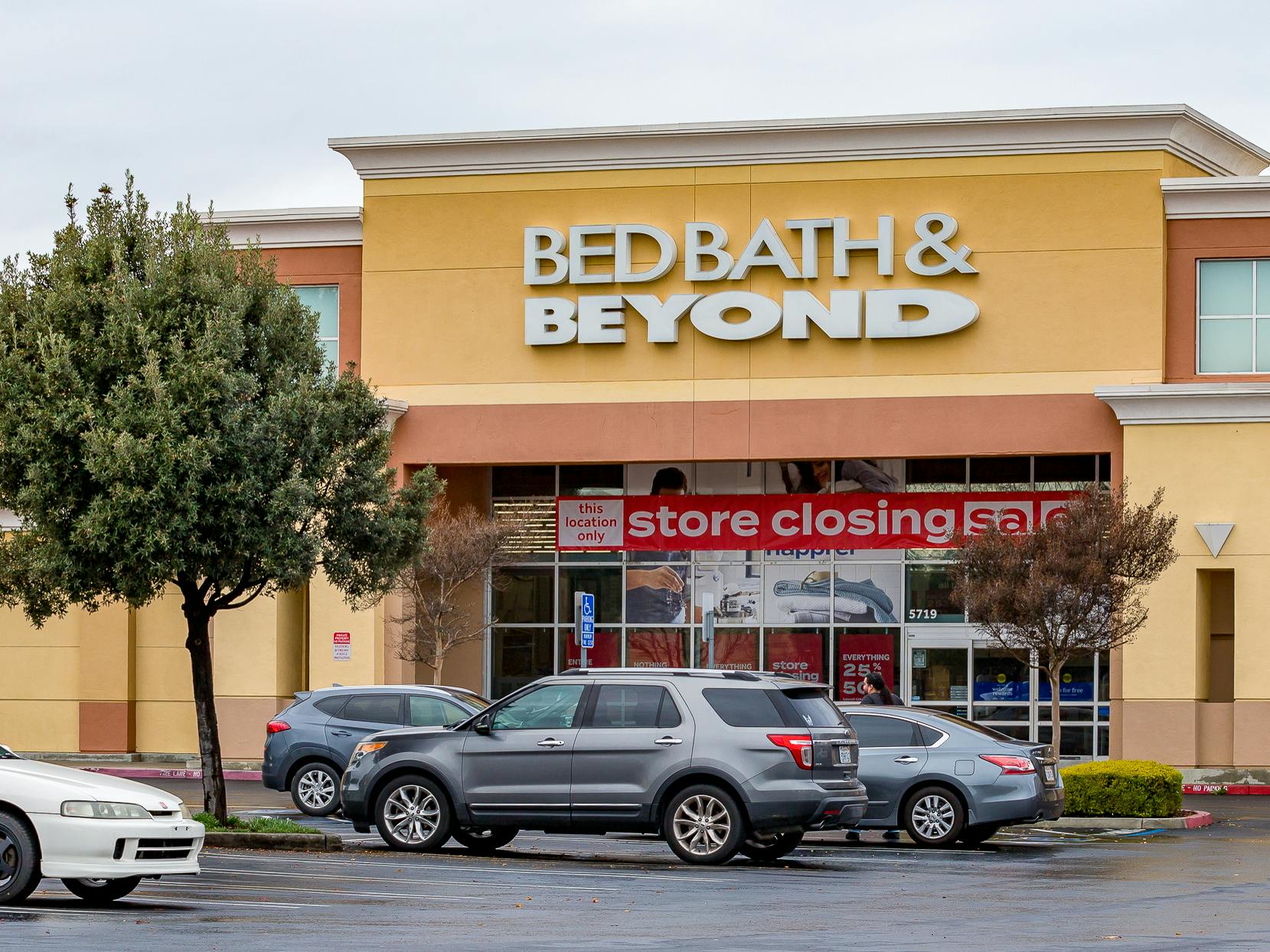 A Bed Bath & Beyond store with a Store Closing sign