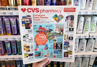 someone holding cvs ad